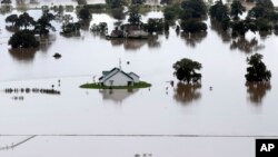 Homes surrounded by floodwaters are shown in this aerial view, in Rosharon, Texas, June 4, 2016. 