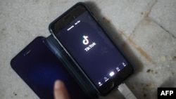 FILE - A person uses the video-sharing app TikTok on a smartphone in New Delhi, in this illustration photo taken June 29, 2020.