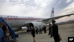 FILE - Passengers disembark an Air Koryo flight in Pyongyang, North Korea.