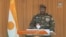 A video frame grab image from ORTN - Télé Sahel showing Niger's new military ruler General Abdourahamane Tiani, reading a statement on national television, Aug 19, 2023
