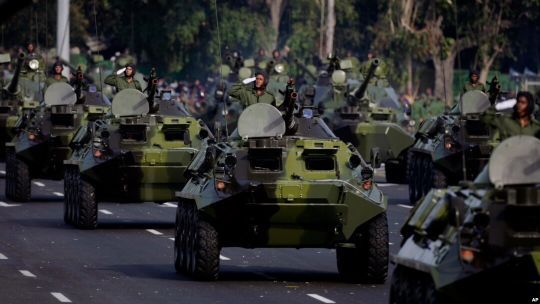 FILE - Cuban military vehicles parade along the Plaza de la Revolucion to mark the 50th anniversary of the failed Bay of Pigs invasion in Havana, April 16, 2011. Cuba on Wednesday announced the launch of five days of nationwide military exercises.