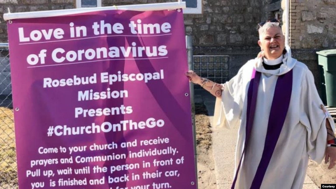 Undated photo of the Rev. Lauren Stanley, standing outside Trinity Episcopal Church, Mission, S.D.  (Courtesy, the Rev. Lauren Stanley)