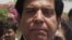 Raja Pervaiz Ashraf is seen as he leaves the Parliament in Islamabad, Pakistan after filing his nomination as a candidate for the premiership. June 21, 2012