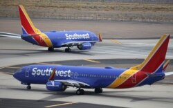 FILE - Southwest Airlines planes are seen at Phoenix Sky Harbor International Airport in Phoenix, Arizona, July 17, 2019.