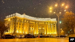 In this undated handout photo released by Ukrainian Foreign Ministry Press Service, the building of Ukrainian Foreign Ministry is seen during snowfall in Kyiv, Ukraine. 