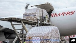 A cargo flight containing over six million medical items including face masks, test kits, face shields and protective suits arrives in the capital Addis Ababa, Ethiopia, March 22, 2020. 