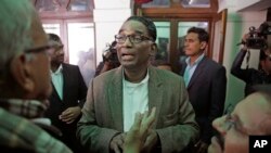 FILE -Indian Supreme Court judge Justice Jasti Chelameswar (C) speaks to reporters, after addressing a press conference in New Delhi, India, Jan. 12, 2018. He is one of four Supreme Court judges complaining openly about the functioning of the top court and the role of the chief justice. 