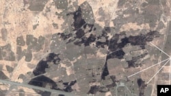 Satellite image of El Feid, South Kordofan State, Sudan, showing burned village