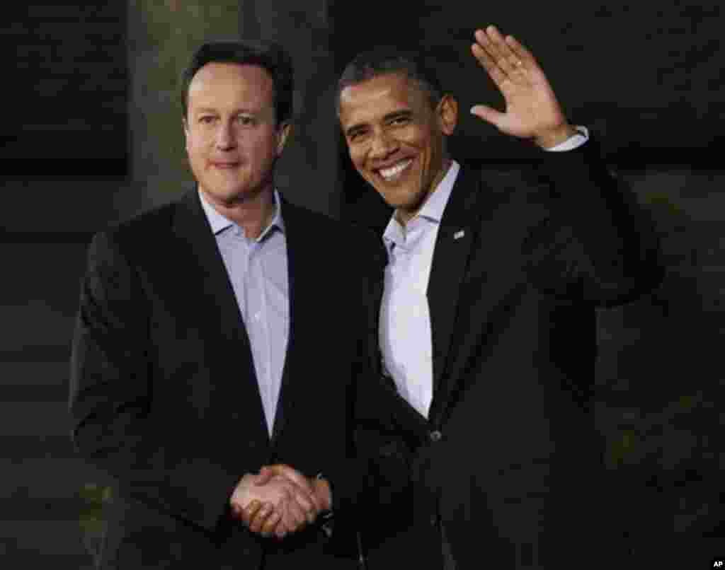President Barack Obama shakes hands with Britain's Prime Minister David Cameron on arrival for the G8 Summit Friday, May 18, 2012 at Camp David, Md. (AP Photo/Charles Dharapak)