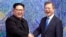 North Korean leader Kim Jong Un, left, poses with South Korean President Moon Jae-in for a photo inside the Peace House at the border village of Panmunjom in Demilitarized Zone, April 27, 2018. 