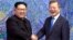 North Korean leader Kim Jong Un, left, poses with South Korean President Moon Jae-in for a photo inside the Peace House at the border village of Panmunjom in Demilitarized Zone, April 27, 2018. 