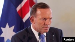 Perdana Menteri Tony Abbott mengukuhkan bahwa pihak berwenang mencurigai gerakan Islamis ISIS mendalangi penembakan imam Syiah di Australia. 