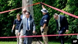 Law enforcement officials work outside of the Trump International Golf Club after the apparent assassination attempt of Republican presidential nominee and former President Donald Trump, Sept. 16, 2024, in West Palm Beach, Fla.