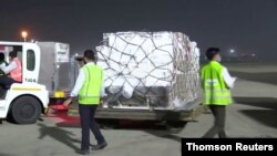 A shipment of vital medical supplies from the United Kingdom arrives in New Delhi, India, April 27, 2021.