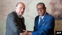 FILE - Colombian Foreign Minister Alvaro Leyva, left, greets Haitian Charge d'Affaires Pierre Philippe Brunet in Bogota, Nov. 7, 2023. Officials of the nations met Dec. 21, 2024, in Colombia to discuss cooperation on issues. (Colombian Foreign Ministry)