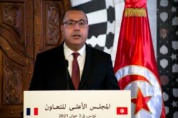 Tunisian Prime Minister Hichem Mechichi gives a press conference in Tunis, June 3, 2021. President, Kais Saied dismissed Mechichi and suspended parliament after violent protests.