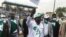 FILE - Albert Pahimi Padacke, center, waves at supporters as he arrives for a campaign rally at the Idriss Mahamat Ouya stadium in N'Djamena, Chad, March 19, 2021.