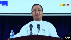 FILE- Junta spokesman Brigadier General Zaw Min Tun speaks during a live news conference in Naypyidaw, April 9, 2021.