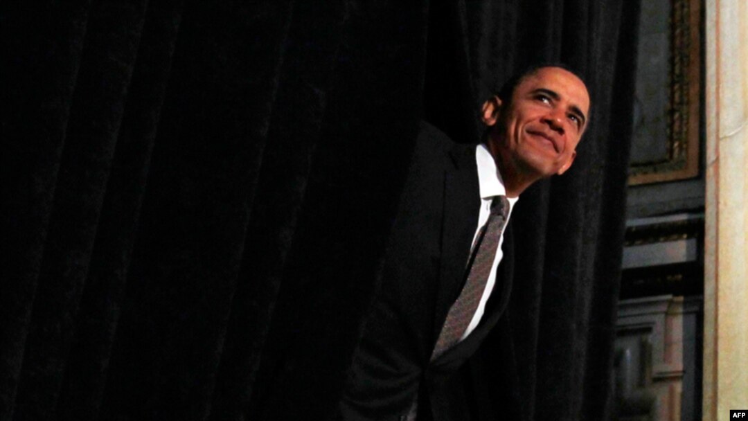 May 12: President Barack Obama steps out from behind a curtain to deliver remarks at the National Hispanic Prayer Breakfast in Washington.(REUTERS/Jim Young)