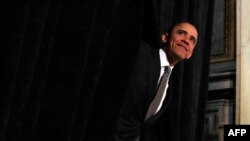 May 12: President Barack Obama steps out from behind a curtain to deliver remarks at the National Hispanic Prayer Breakfast in Washington.(REUTERS/Jim Young)