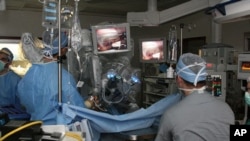 Doctors perform surgery using a robotic system.