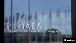 FILE - The logo of the International Atomic Energy Agency is seen at its headquarters in Vienna.