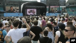 The crowd watch Coldplay performs during the Sound relief concert in Sydney, Australia, March 14, 2009, in aid of the Victorian bushfire appeal. 