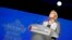 FILE - French far-right leader Marine Le Pen gestures as she delivers a speech to announce a name-change for her National Front party, in Bron, central France, June 1, 2018.