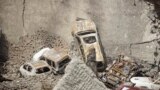 The collapsed upper car park of the Westgate Mall in Nairobi, Kenya. Working near bodies crushed by rubble in a bullet-scarred, scorched mall, FBI agents continued fingerprint, DNA and ballistic analysis to help determine the identities and nationalities of victims and al-Shabab gunmen who attacked the shopping center, killing more than 60 people.