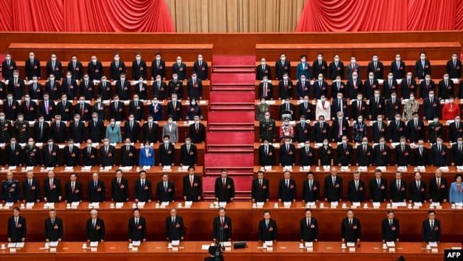 FILE - Chinese President Xi Jinping, center, and other leaders sing the national anthem during the opening session of the National People's Congress, March 5, 2023, at the Great Hall of the People in Beijing. The nation's 2024 legislative meetings will begin on March 4.