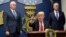 FILE - President Donald Trump, center, signed two executive actions at the Pentagon in Washington, Jan. 27, 2017, with Vice President Mike Pence, left, and Defense Secretary James Mattis at his side.