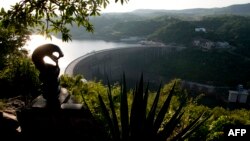  A general view of the the Kariba Dam wall between Zimbabwe and Zambia, Feb. 19, 2015, on the eve of the signing of $294 million in deals with international investors. The overhaul project will fix deformities and cracks in walls that were discovered