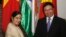 India's Foreign External Affairs Minister Sushma Swaraj (L) poses for a photo with Vietnam's Deputy Prime Minister and Foreign Minister Pham Binh Minh before their meeting in Hanoi, August 25, 2014.