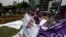 FILE - Supporters of "All for Peru" party's presidential candidate Julio Guzman are seen outside the country's electoral board in Lima, Feb. 16, 2016.