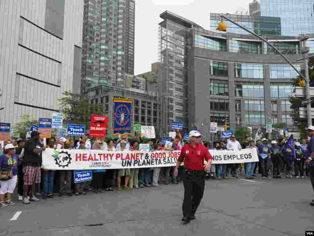 Dozens of labor unions representing teachers, electricians, nurses and more in the People's Climate March. (Rosanne Skirble/VOA)