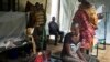 FILE - In this May 24, 2014, file photo, a South Sudanese family waits in the cholera isolation ward of Juba Teaching Hospital in the capital Juba. 