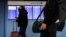 FILE - Travelers walk through O'Hare International Airport ahead of the Thanksgiving holiday in Chicago, Illinois, Nov. 20, 2021. 