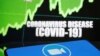 Zoom logo is seen in front of diplayed coronavirus disease (COVID-19)