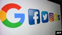 (FILES) In this file photo taken on October 21, 2020 shows the logo of the multinational American Internet technology and services company, from left : Google, the American online social media and social networking service, Facebook, Twitter,…