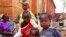 Internally displaced children, who are escaping the violence, pose at Bangui's Saint Paul's Church December 17, 2013. Some European countries will send troops to support a French-African mission to restore order in Central African Republic, French Foreign