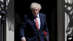 Britain's Prime Minister Boris Johnson leaves Downing Street to attend the weekly session of PMQs in Parliament in London as the country continues its lockdown to help stop the spread of coronavirus, May 20, 2020.