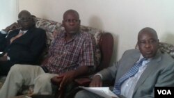 FILE: War Veterans Minister Tshinga Dube seen here with fired War Veterans Minister Christopher Mutsvangwa on the day war veterans were engaged in street skirmishes with police in Harare this year.