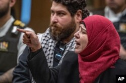 Manal Dokhan gestures as she gives her victim impact statement during the sentencing hearing for Australian Brenton Harrison Tarrant at the Christchurch High Court.