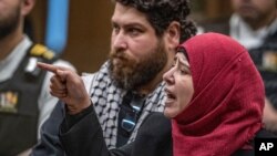 Manal Dokhan gestures as she gives her victim impact statement during the sentencing hearing for Australian Brenton Harrison Tarrant at the Christchurch High Court, New Zealand, Aug. 26, 2020.