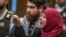 Manal Dokhan gestures as she gives her victim impact statement during the sentencing hearing for Australian Brenton Harrison Tarrant at the Christchurch High Court, New Zealand, Aug. 26, 2020.