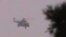 Shaam News Network image purports to show Syrian helicopter firing on village near Daraa, June 16, 2012.