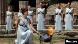 Ancient Greek discoveries still play a part in our modern American English. Here an actor plays the role of an ancient Greek High Priestess during the Olympic flame lighting ceremony for the Rio 2016. (REUTERS/Yannis Behrakis)