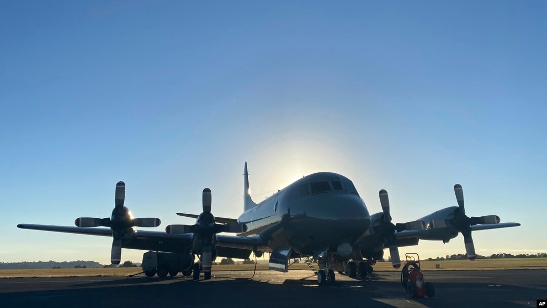 In this photo provided by the New Zealand Defense Force, an Orion aircraft is prepared at a base in Auckland, New Zealand, Jan. 17, 2022, before flying to assist the Tonga government after the eruption of an undersea volcano. 