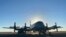 In this photo provided by the New Zealand Defense Force, an Orion aircraft is prepared at a base in Auckland, New Zealand, Jan. 17, 2022, before flying to assist the Tonga government after the eruption of an undersea volcano. 