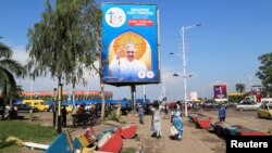A view shows a billboard of Pope Francis, a day ahead of his arrival near the Stadium of the Martyrs where he will meet Congolese youth in Kinshasa, Democratic Republic of the Congo, Jan. 30, 2023.